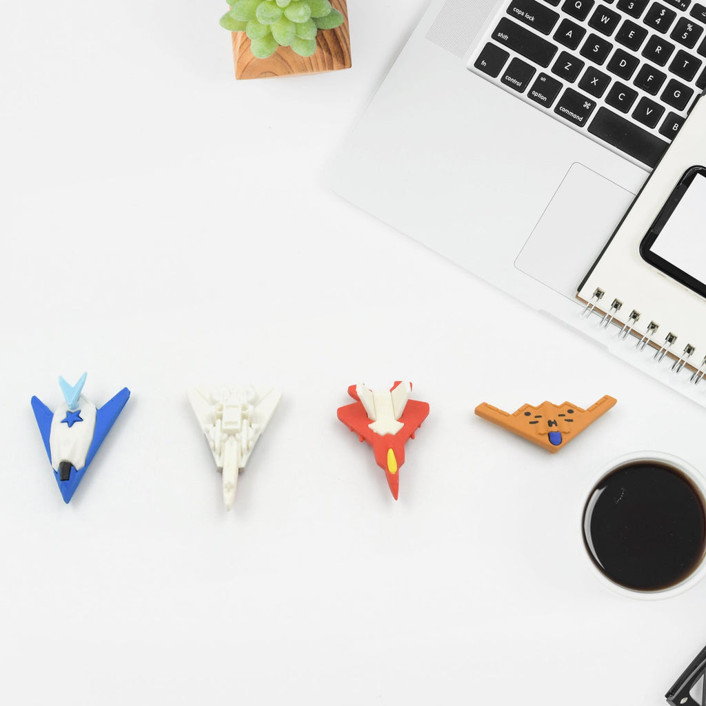 A gift set of fun erasers featuring airplane and gun designs for kids.