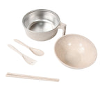 Close-up of the essential cutlery: wheat straw chopsticks, fork, and spoon from the dining set.