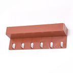 Side profile of the Bathora Key Holder Stand, highlighting its compact structure and integrated storage shelf.