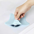 Flexible silicone starfish sink filter, featuring strong suction cups for stability.