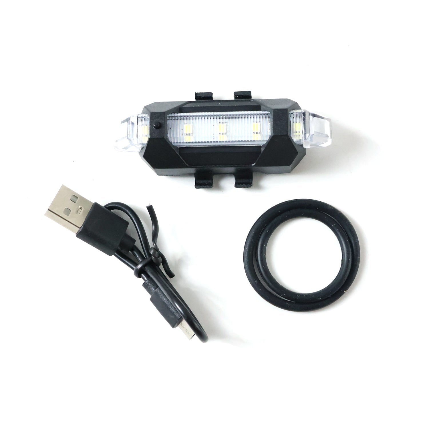 Multipurpose LED bicycle safety light attached easily, demonstrating versatile mounting.