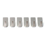 Wall hooks hanging keys and towels in home setting