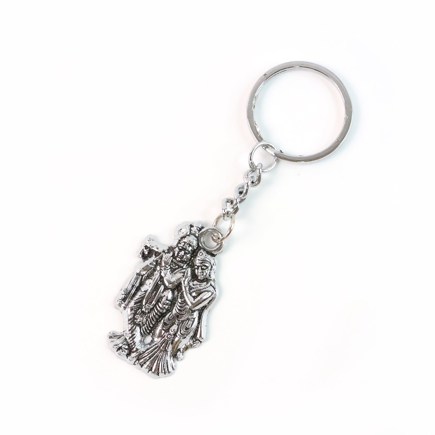 Radha Krishna metal keychain packaged in eco-friendly Peepal leaf blister pack