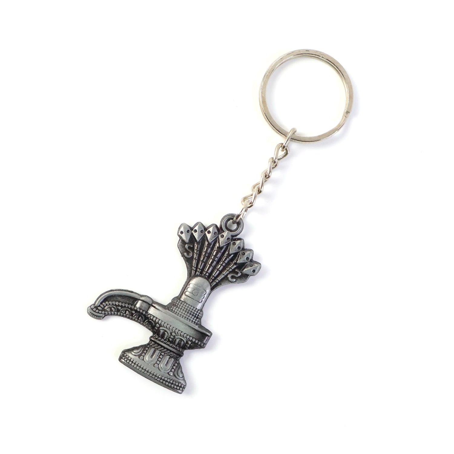 Hand holding Shiva Lingam metal keychain with spiritual Naag motif