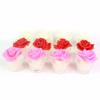 Textured glass holder enhancing the soft glow of rose shaped LED candle
