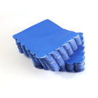 Close-up view of soft absorbent texture of royal blue paper napkin