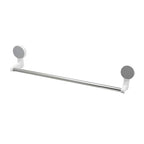 Wall-mounted adhesive towel rod holding towels in bathroom setting