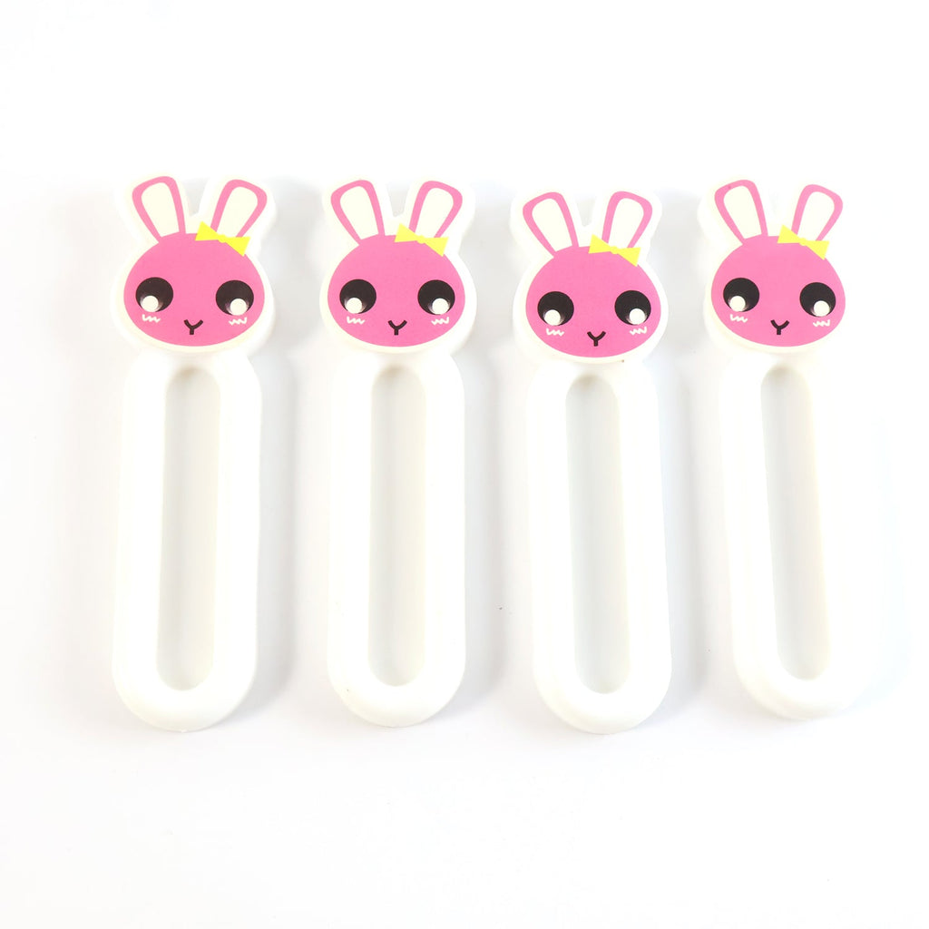 Pull handles mounted on cabinet doors using self stick push pull helper set