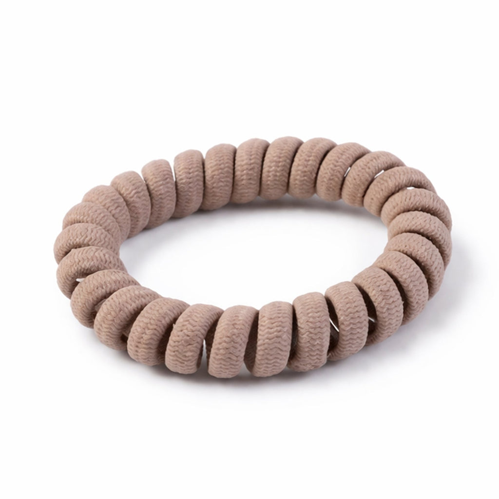 Close-up of flexible hair elastic band in coil style