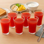 Close-up of a single 300ml plastic juicy glass with a panelled design.