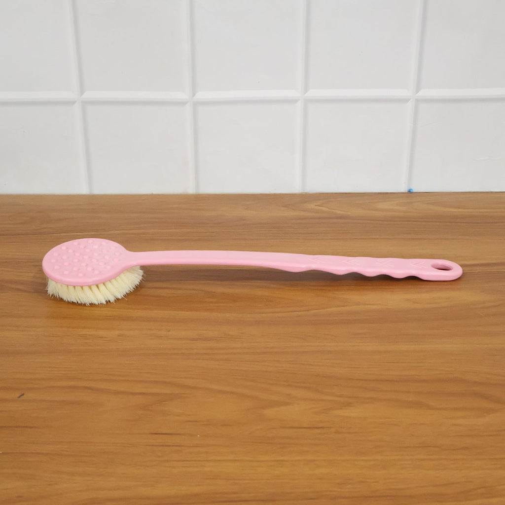 Velvet Wipe back scrubber demonstrating its extended handle for full back coverage during bathing.
