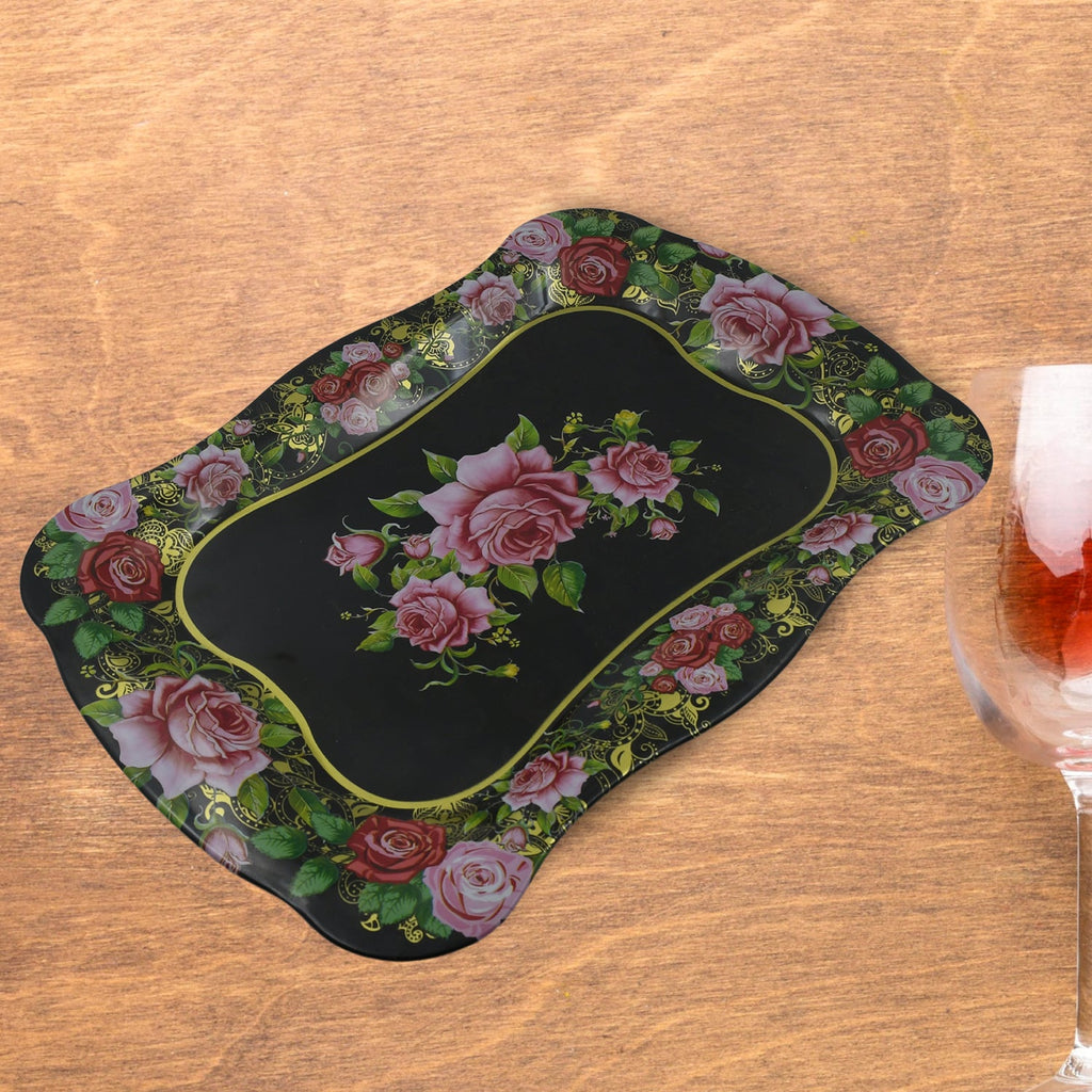 Close-up of the intricate floral pattern on the durable stainless steel serving tray.
