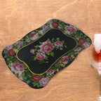 Close-up of the intricate floral pattern on the durable stainless steel serving tray.