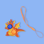 Side view of the dragon-shaped push pop fidget toy