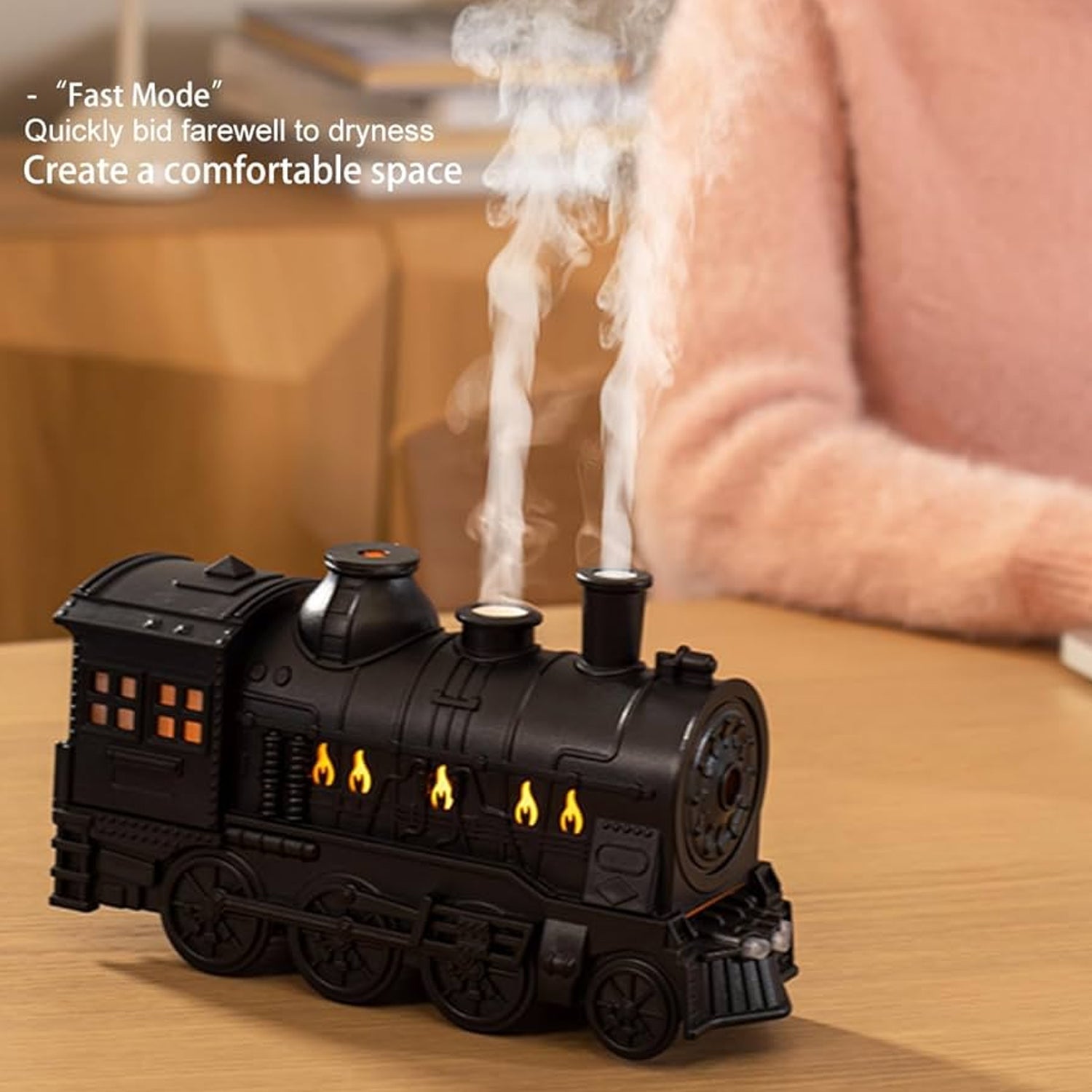 Portable mini humidifier with retro train aesthetic and mist output