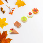 Kids' hands holding a selection of the fun 3D fast food erasers.
