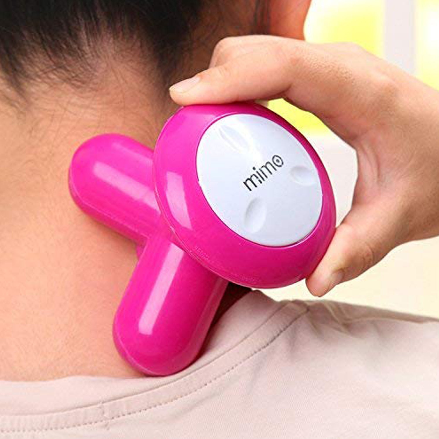 Person using the vibration massager on their arm for quick muscle recovery.