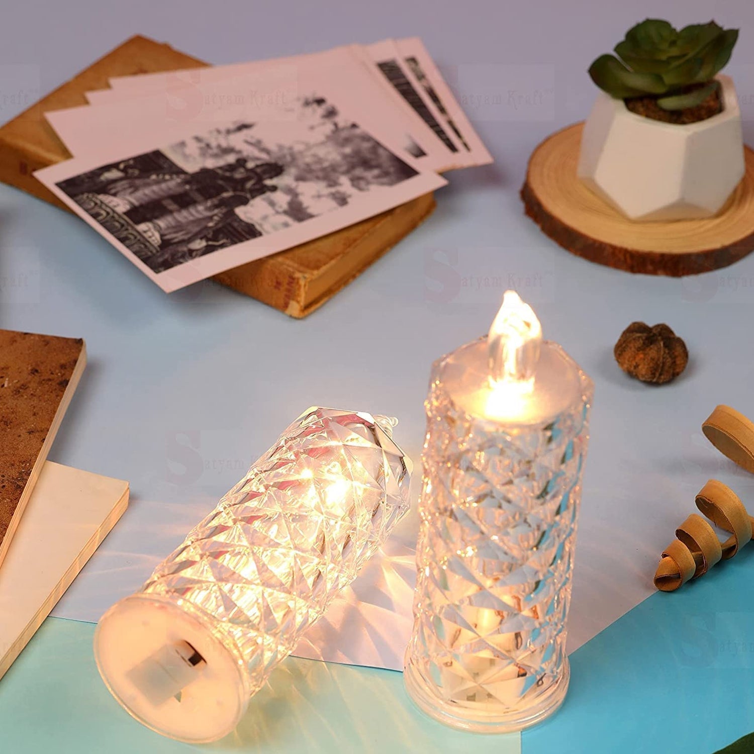 Flameless rose candle with a clear acrylic base, ideal for festive decorations.