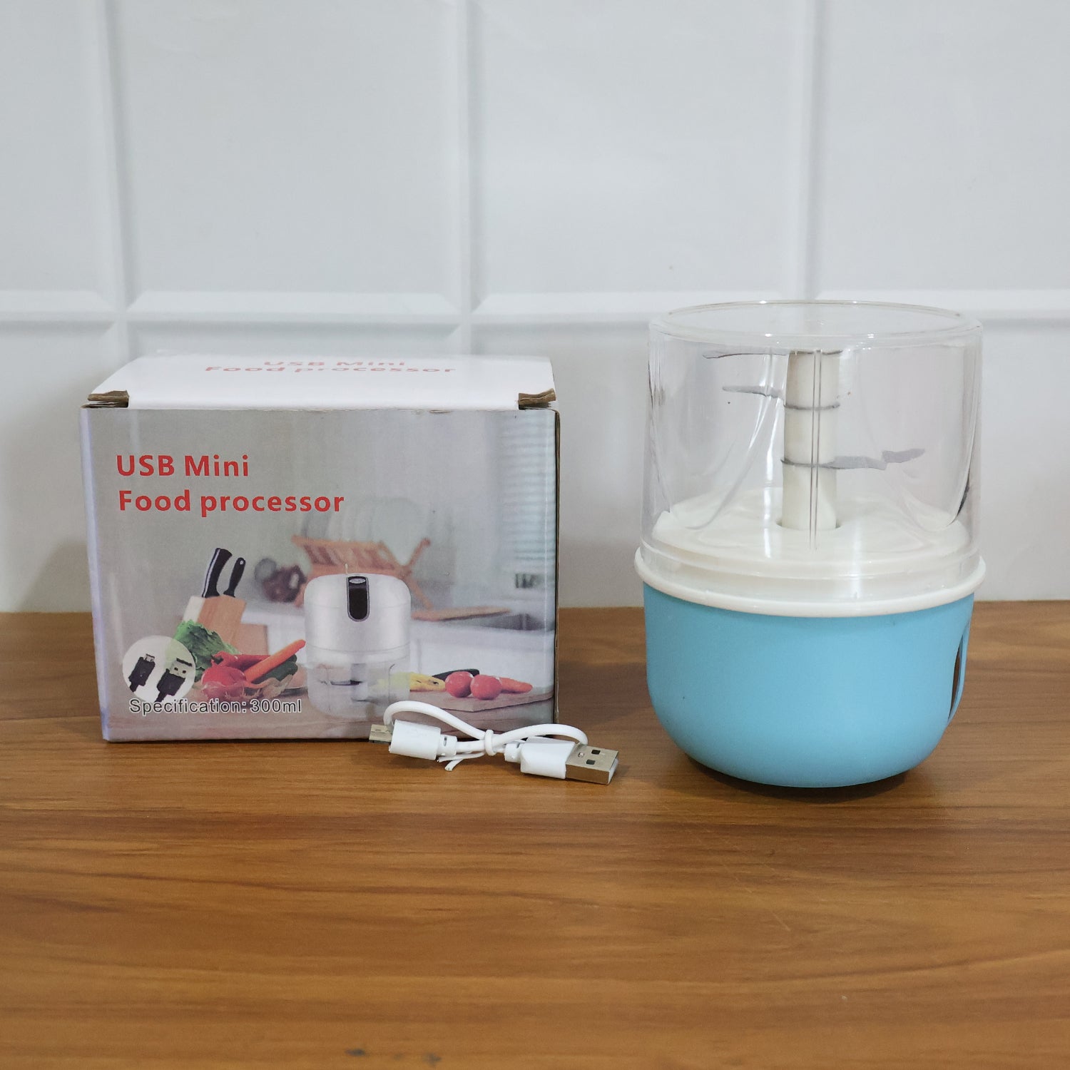 Showcasing the compact design of the mini electric garlic chopper, saving counter space.