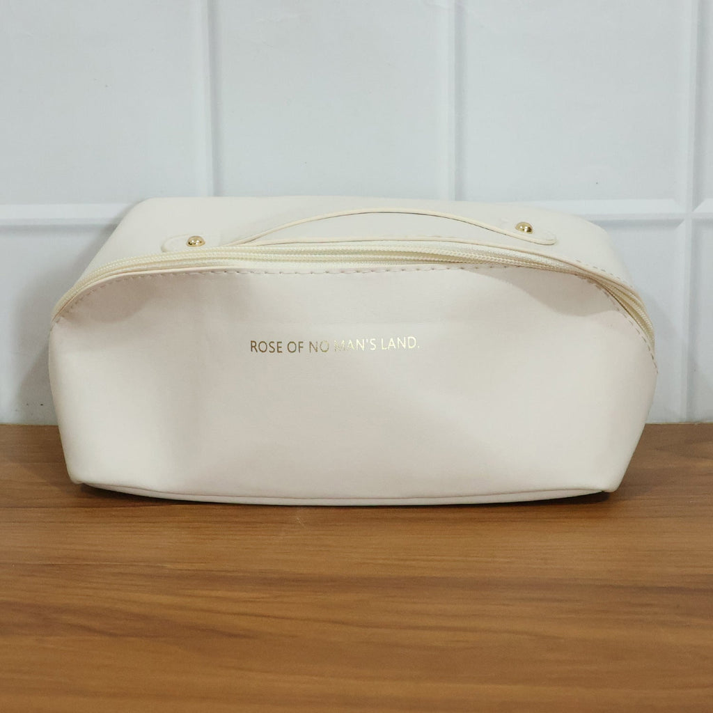 Open travel organizer pouch displaying internal compartments for toiletries