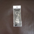 Back view of the Mahakal Trishul Keychain, highlighting its solid metal construction.