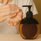 Close-up of smooth pump mechanism on refillable liquid soap dispenser
