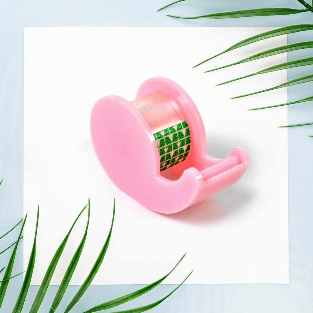 The tape dispenser with transparent tape, a key component of the mini office stationery set.