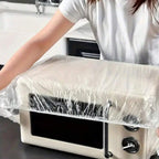 Elasticated plastic couch protector securely fitted over a sofa.
