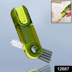 The multifunctional bottle cleaning brush effectively reaching inside a tall bottle.