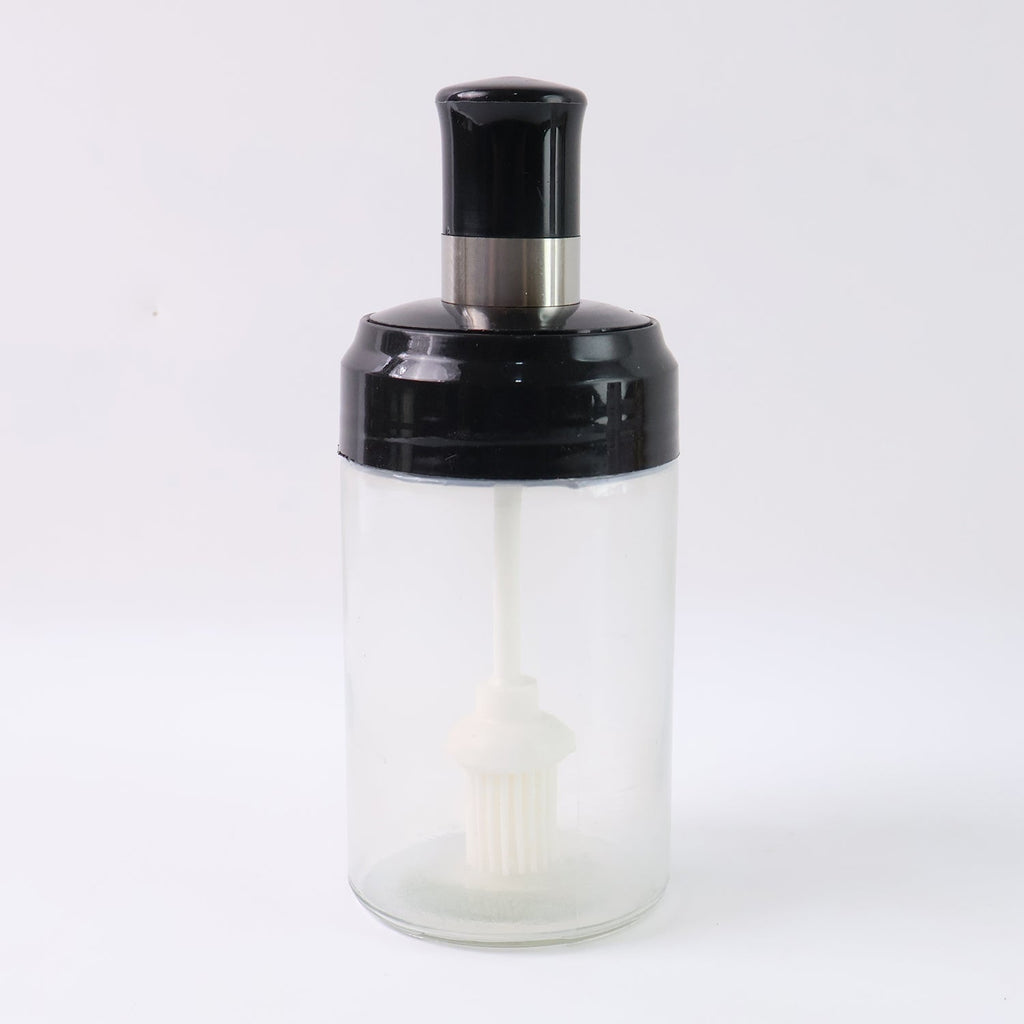 Crystal clear oil dispenser bottle featuring silicone basting brush applicator