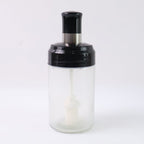 Crystal clear oil dispenser bottle featuring silicone basting brush applicator