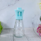 Efficient oil sprayer bottle being used to apply vegetable oil for a healthy meal.