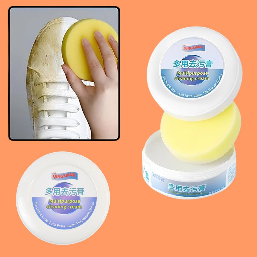 Hand applying Velvet Wipe Shoe Cleaning Cream with a sponge to a dirty sneaker, showing the cleaning process.