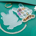 Transparent plastic storage box featuring a cheerful cartoon bear design.
