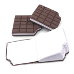 Several chocolate scented diaries in bite-shape, playfully arranged together.