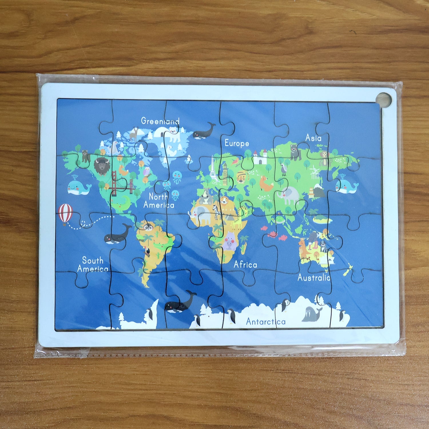 Interactive wooden world map puzzle for kids, promoting hands-on learning.