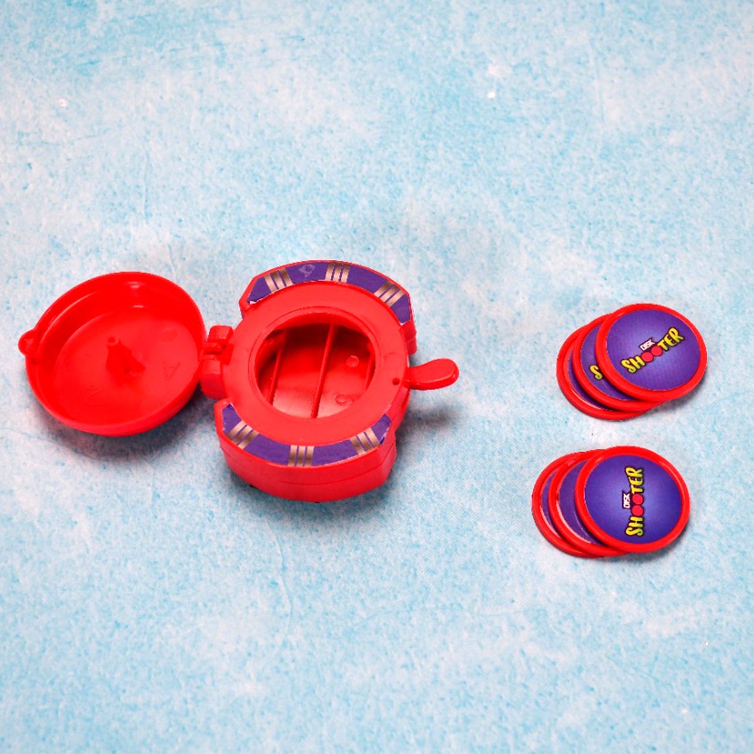 Kids hand disk shooter toy with vibrant discs ready for action.