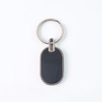 Monogram edge silver and black oval metal key holder accessory