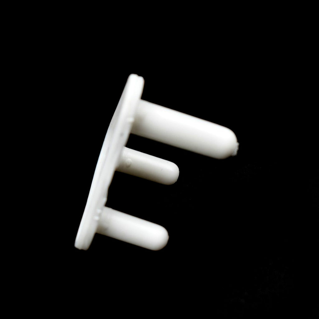 Angled view of multiple Velva Baby outlet plug covers.