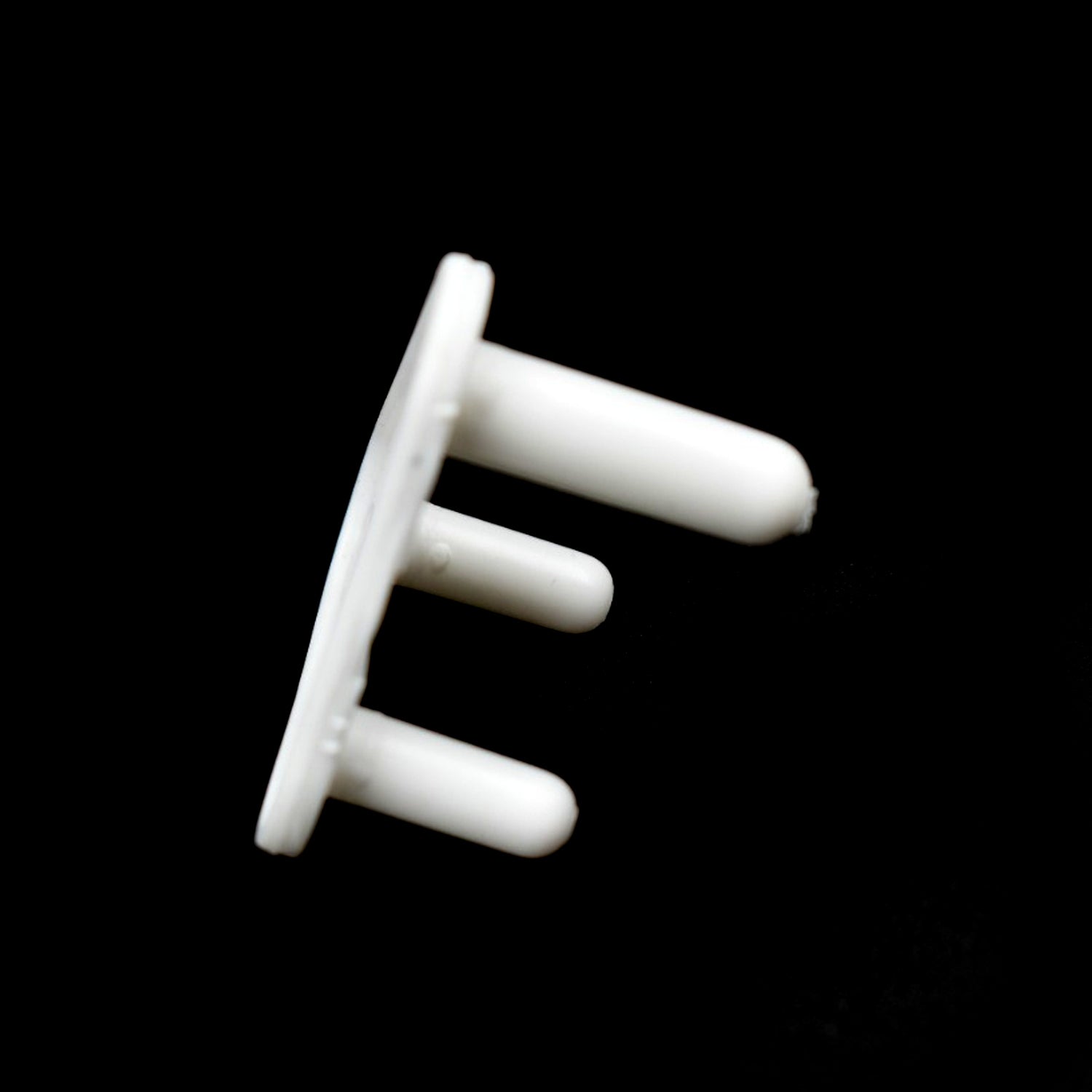 Angled view of multiple Velva Baby outlet plug covers.