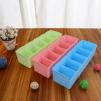 Innovative compartmentalized storage boxes providing efficient wardrobe organization for small items.