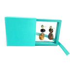 Side view of transparent magnetic jewellery display box on stand
