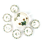 Modern 9-piece cutlery set ready for serving sweet dishes.