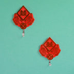 Self-adhesive hooks in use, holding household gloves for easy access.