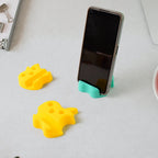 Close-up view of apple nest stand featuring pen storage and phone holder