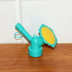 Bottle sprinkler head nozzle showing compact, portable gardening accessory