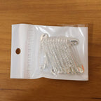 Size comparison of silver safety pin brooches from the 12-piece set
