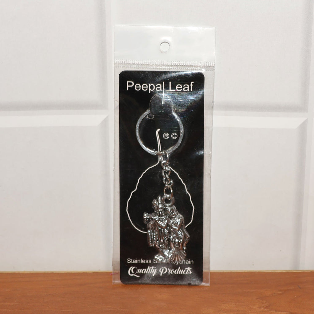 Back view of Radha Krishna metal keychain showing craftsmanship