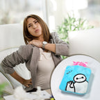 Person using the blue hot water bag to soothe menstrual cramps.