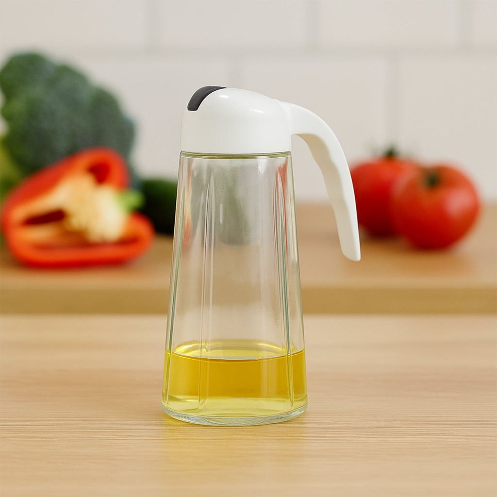 Glass oil bottle dispenser showing measuring marks and leak-proof spout